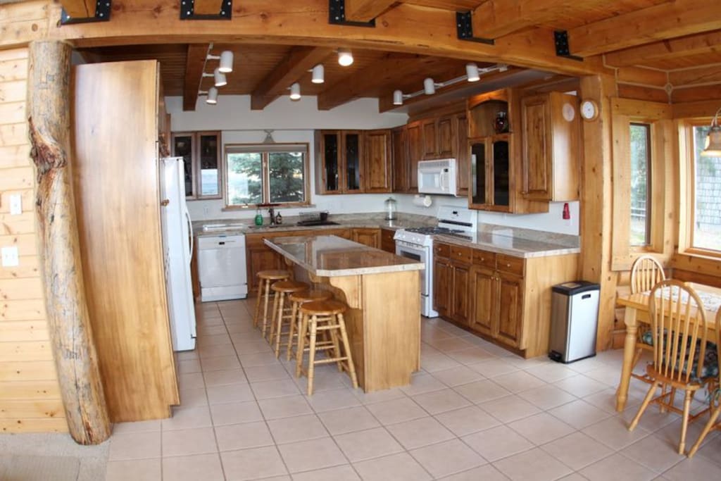 Fully stocked kitchen with beautiful finishes and classic cabin decor