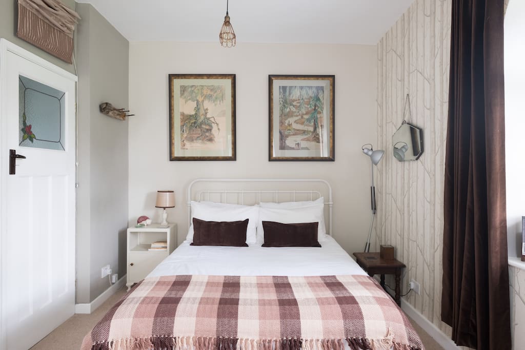 Woodland themed room in calm neutrals. Hotel grade bedding,