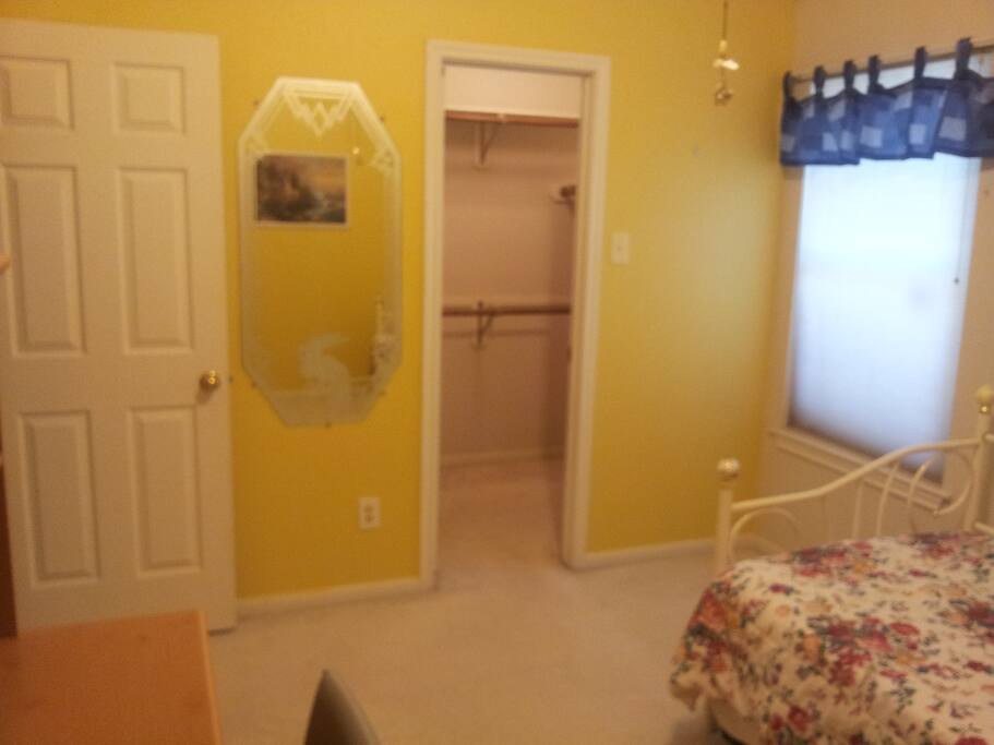 Room with walk-in closet