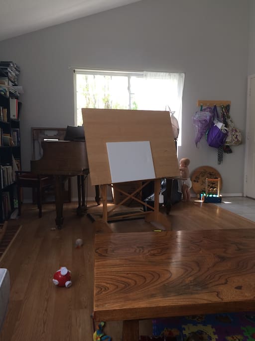 Living room photo 2, you can see piano, easel, and my baby!
