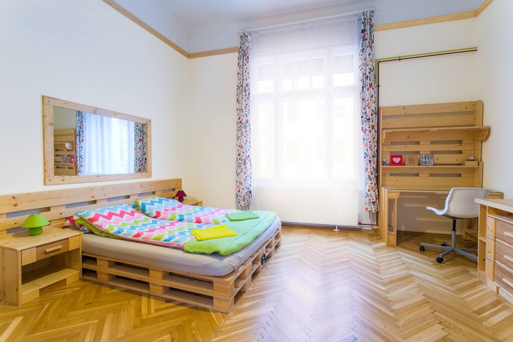 Bedroom 21 m2 with a double bed (160x200) and a sofa bed (140x200) which is on the left, behind the door. As furnishing there are also a desk with a chair, and a smaller and a bigger wardrobe.