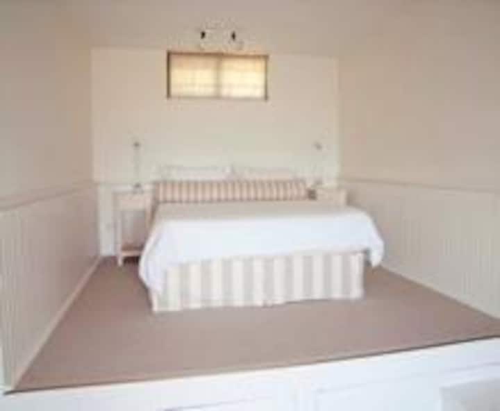 Downstairs suite (self contained with bathroom and lounge) - two extra beds (singles) are available downstairs