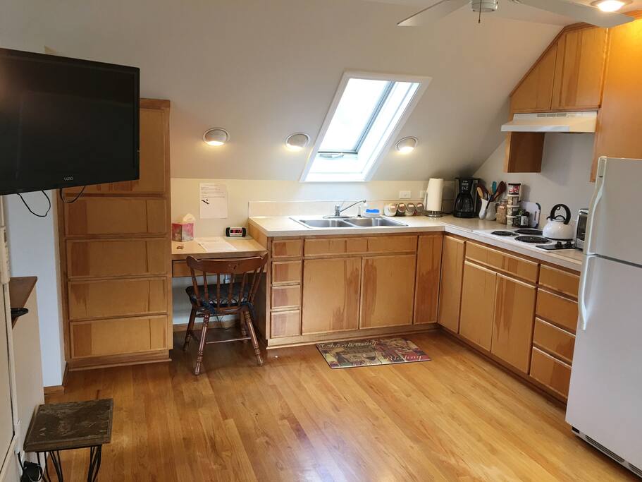 Plenty of cupboard space for everything you'll need. Convenient work desk for laptop convenience.
