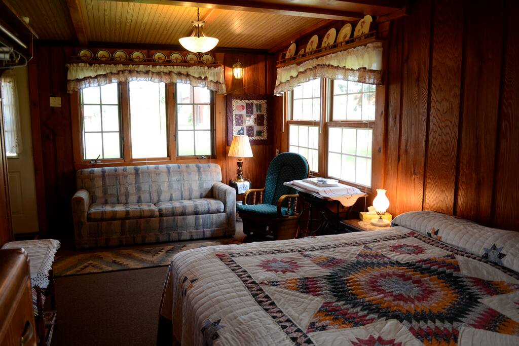 Sitting room and first bedroom share the same space