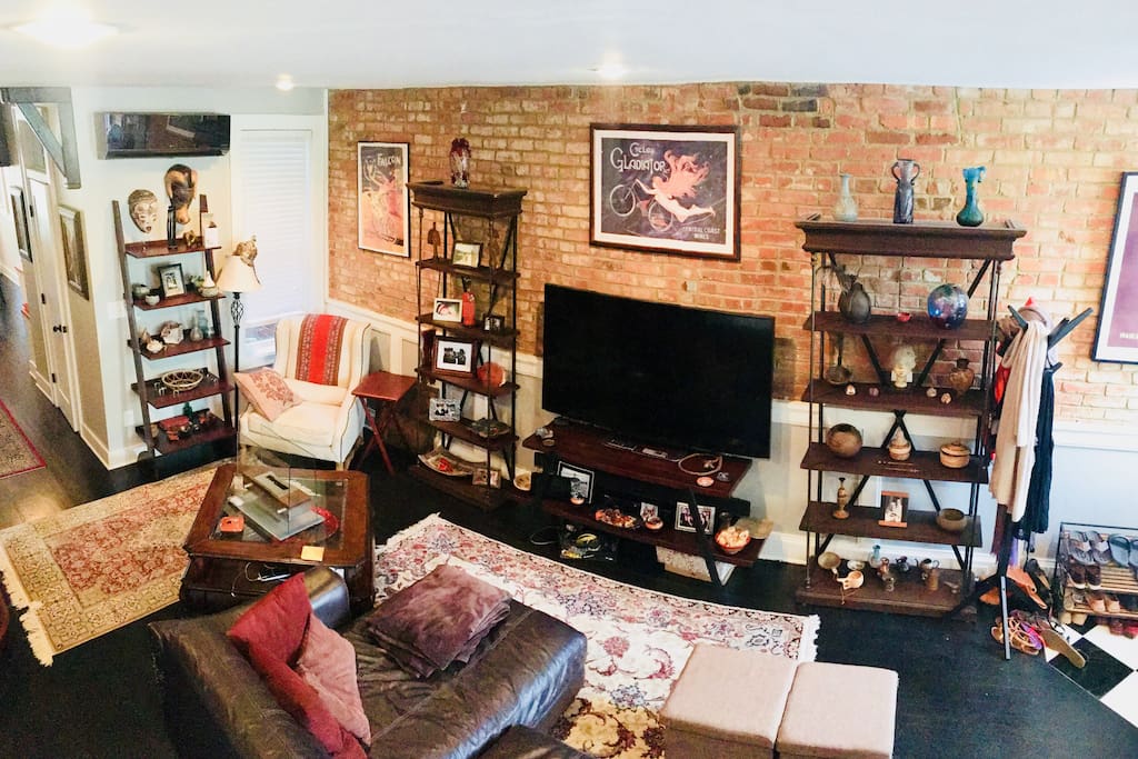 Cozy, eclectic living spaces with an ethanol fireplace on the coffee table.