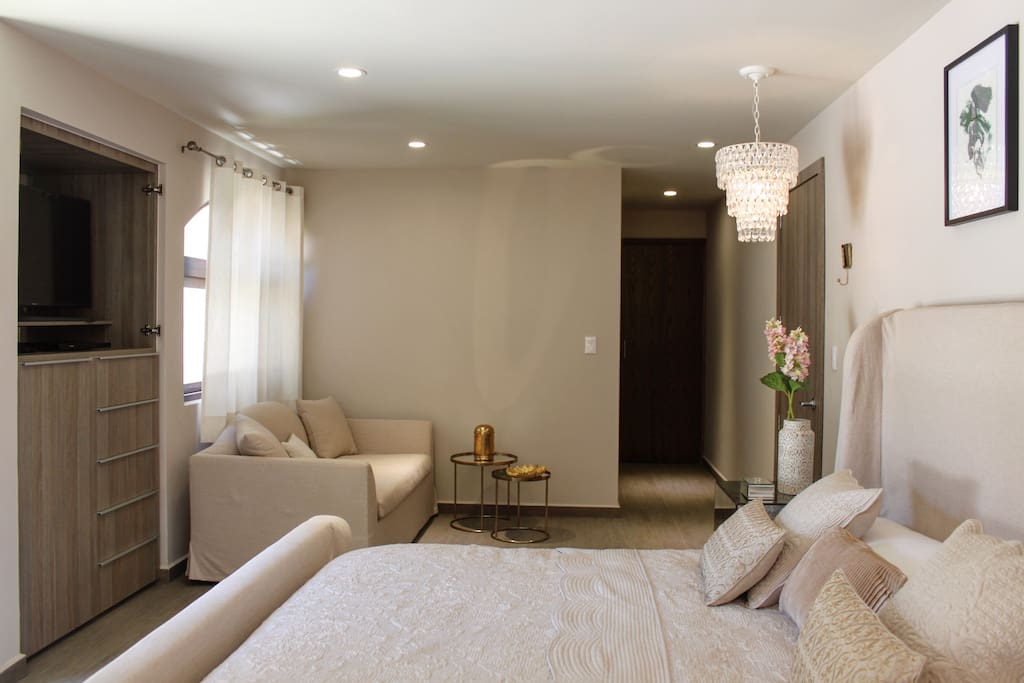 Master Bedroom With King size bed, sofa & Bathroom.