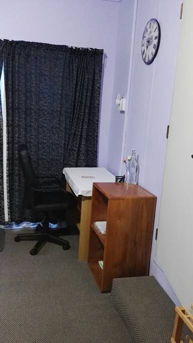 Small study table with comfortable chair.