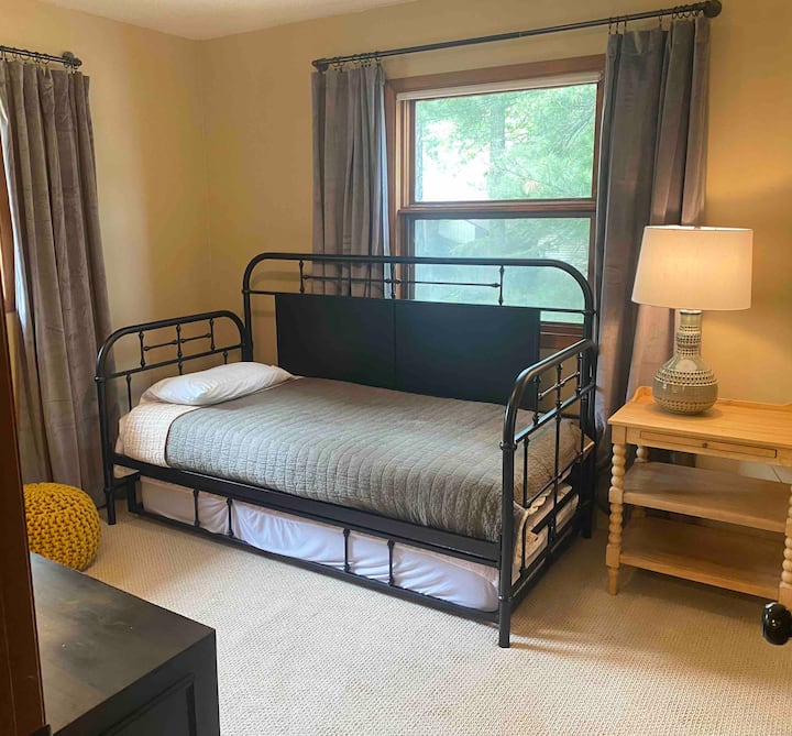 The second main floor bedroom has a twin bed with a pull-out trundle, plus new carpet and furniture. A sweet, simple space for extra guests.”