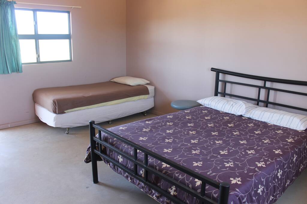 Room 2, air-conditioned, linen provided, fridge, $30.00 per night per person, separate ablutions and cooking facilities. Sleeps 3