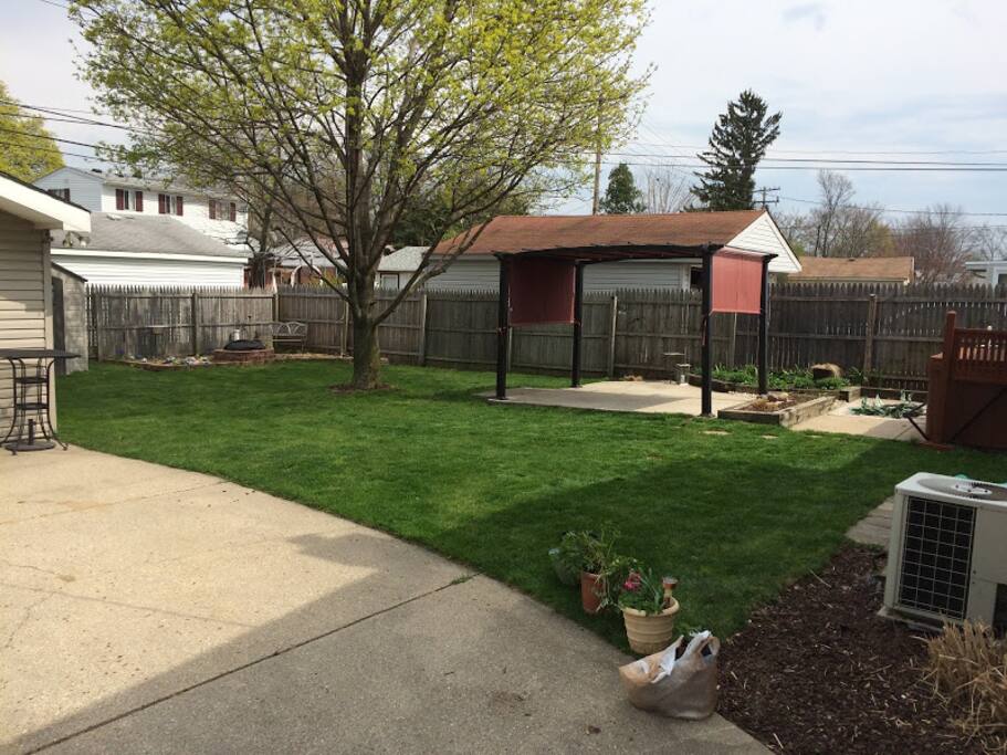Shot of the Back Yard, with bonfire pit, canopy