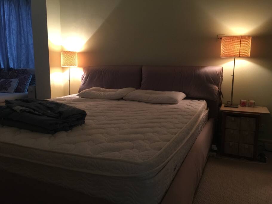 Cozy kingsized bed with romantic lights