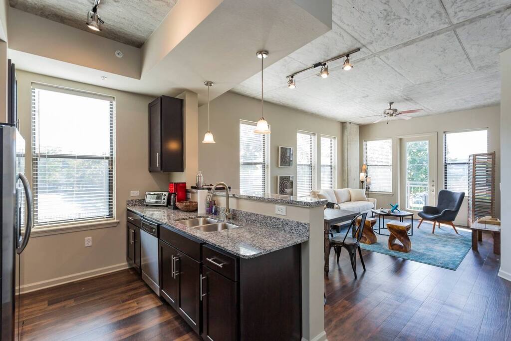 Fully equipped kitchen with ample cooking space and full size dishwasher