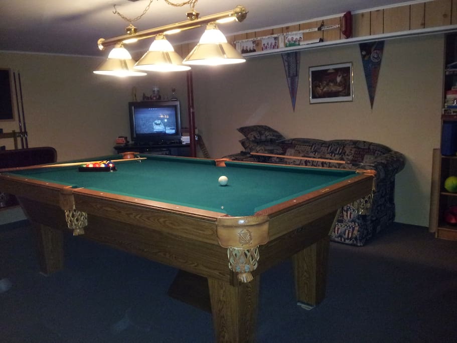 Games room with upgraded satellite TV, VCR, sports videos, electric fireplace, darts, board games