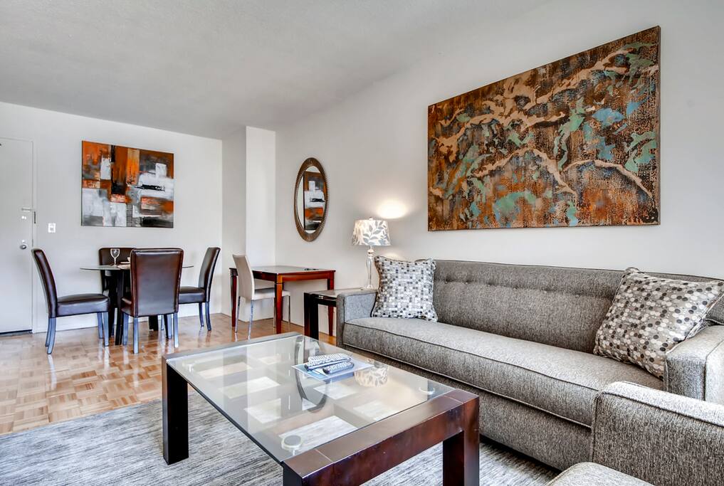 Living room area with dining table and desktop work space