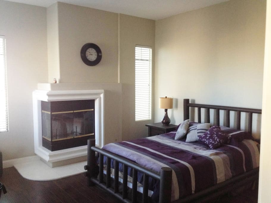 Large Bedroom Suite with attached master Bathroom including double sink, large tub, separate enclosed shower, and a restroom with it's own door for privacy.