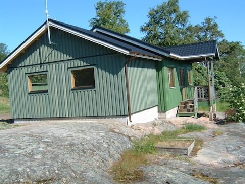 Green cottage with lake view