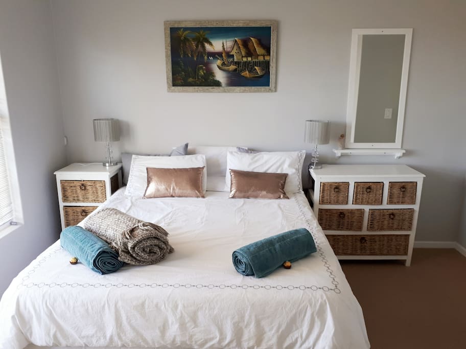 Main bedroom #1. Queen bed with a super comfy Cloud9 mattress with a private en-suite bathroom, built-in-cupboards and bed side draws for clothing and other storage spaces. Your bedroom is equipped with sufficient charging ports as well as mosquito mats for the Summer nights.