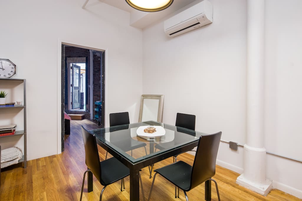Enjoy a meal with the company of your friends. Glass table seats four.