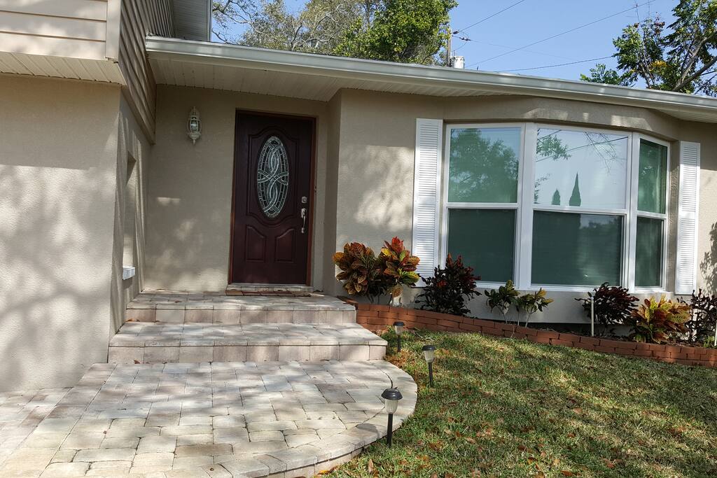 Paver walkway to welcoming front door.