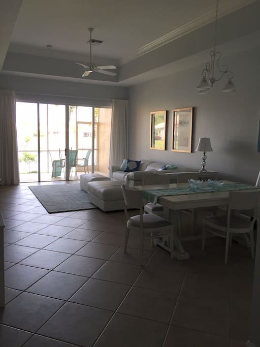 Living room and lanai overlooking small lake.