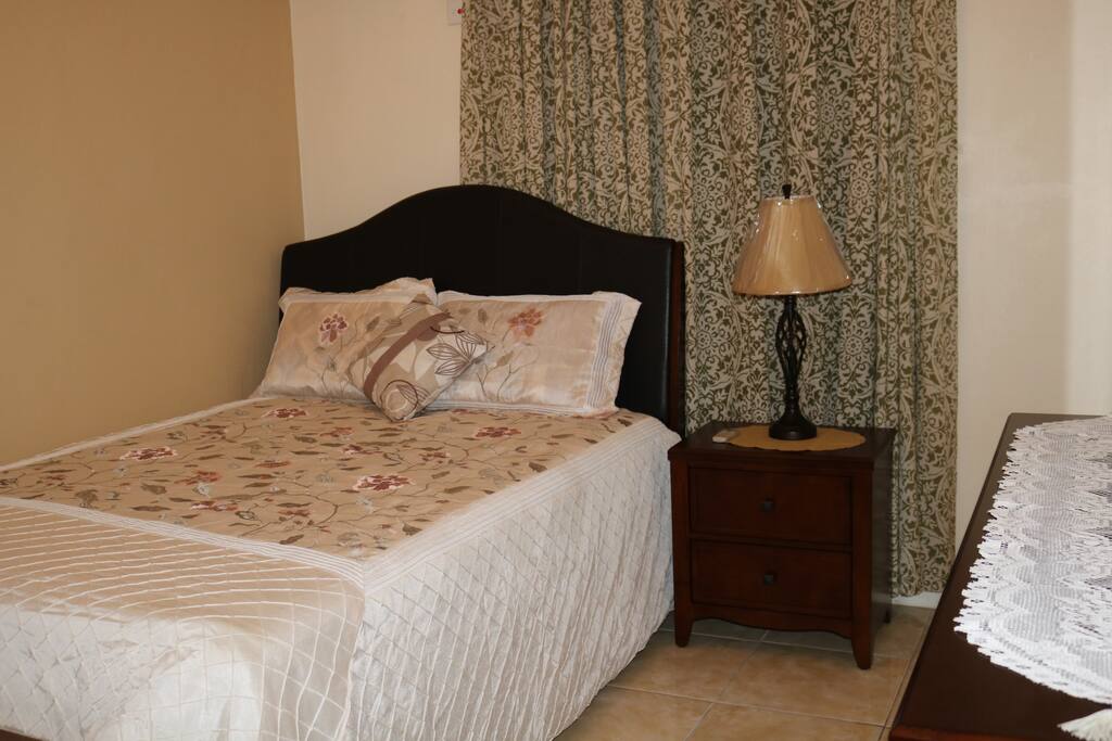 Master Suite, Comfy Queen sized mattress, dresser and bedside table.