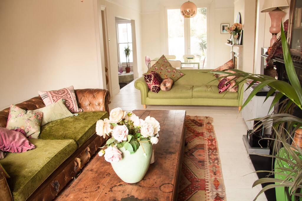 Open plan living room through to french doors onto terrace and garden