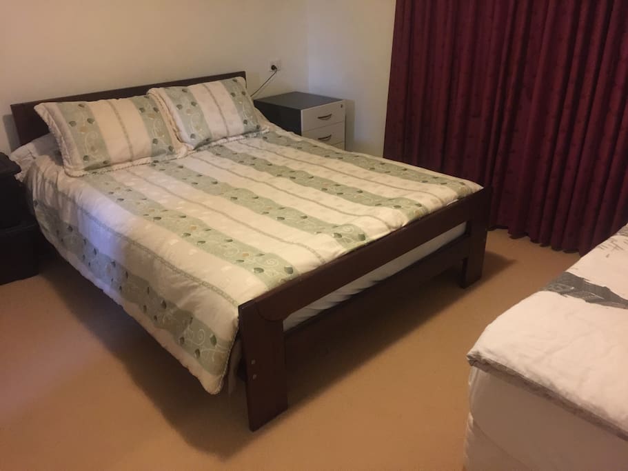 Very comfortable queen sized bed in separate bedroom.