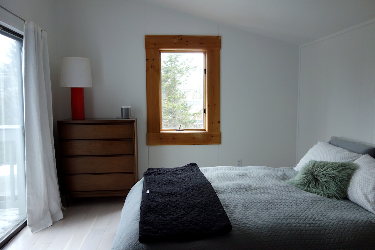 Master bedroom with sliding door to balcony
