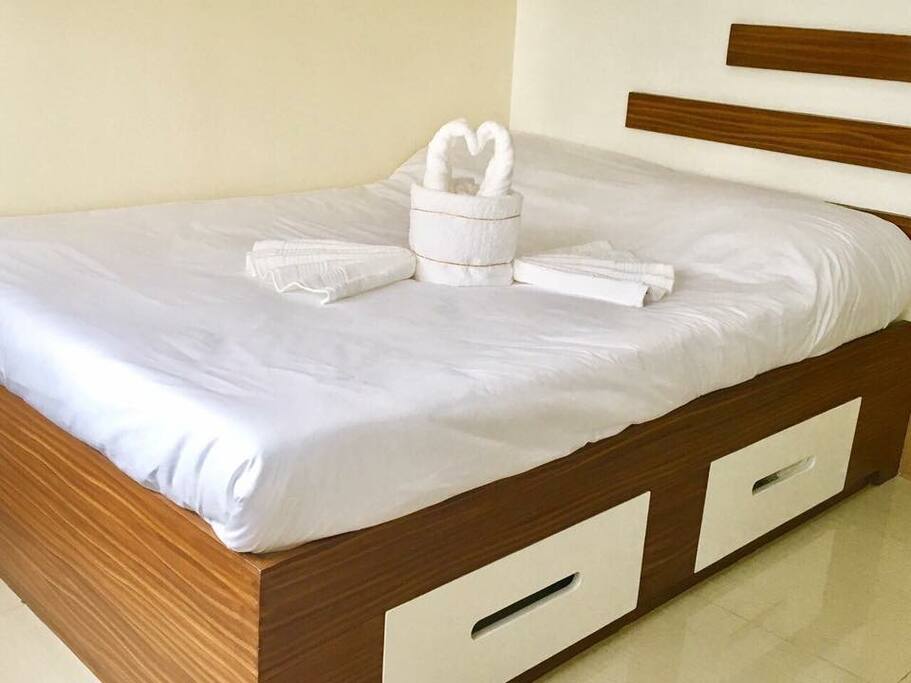Title: DOUBLE BED
Description: Integrated headboard and deep drawers, encased decorative wood base.