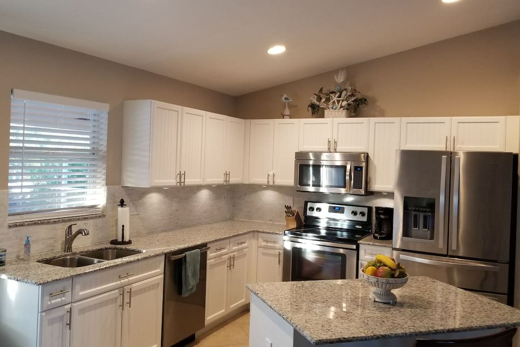 Newly renovated kitchen. Granite counters, marble backsplash and all new maple cupboards.