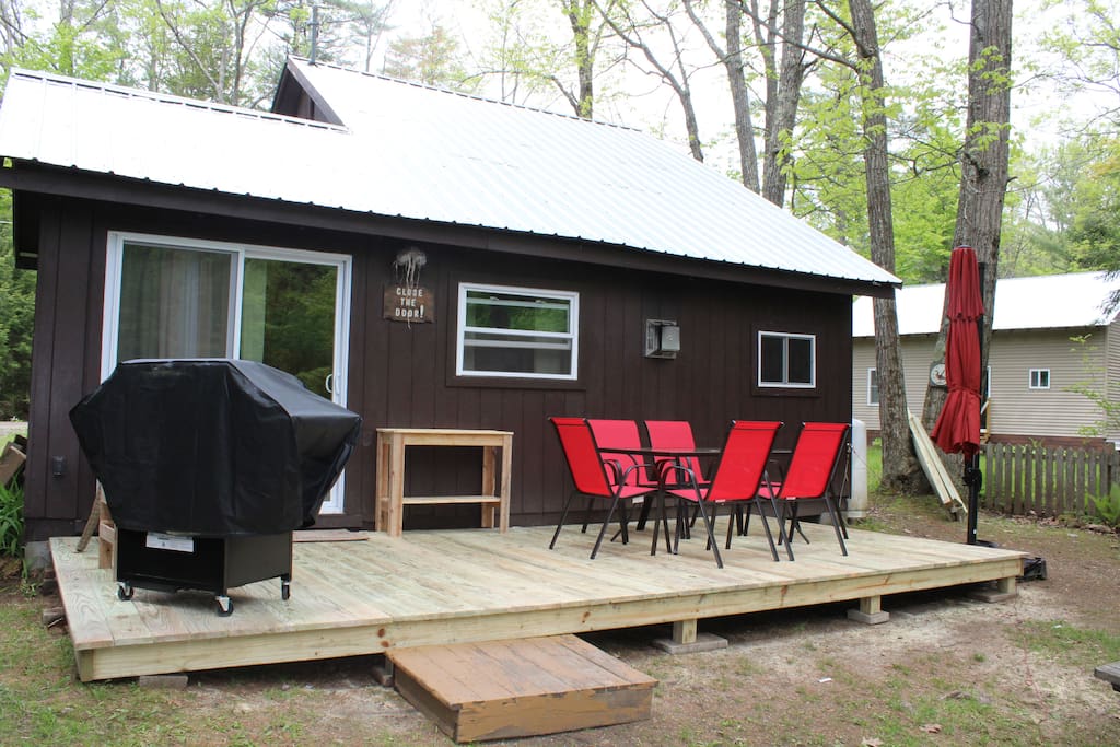 Back yard. 10 ft X 20 ft Deck. New patio furniture and grill.