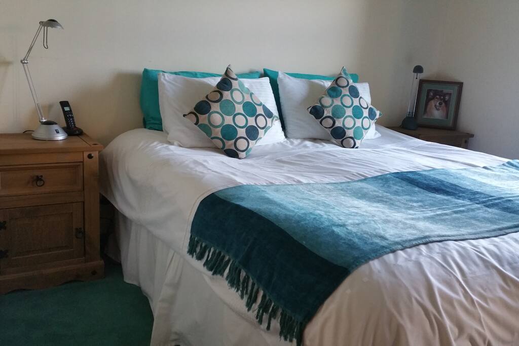 Superking-size bed with cabinets