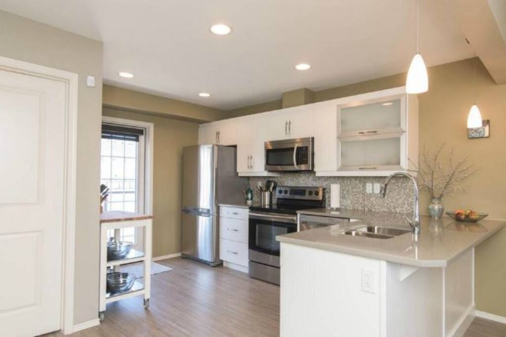 Open concept kitchen with great lighting.