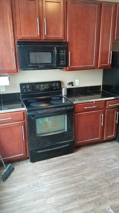 kitchen, microwave, full sized fridge