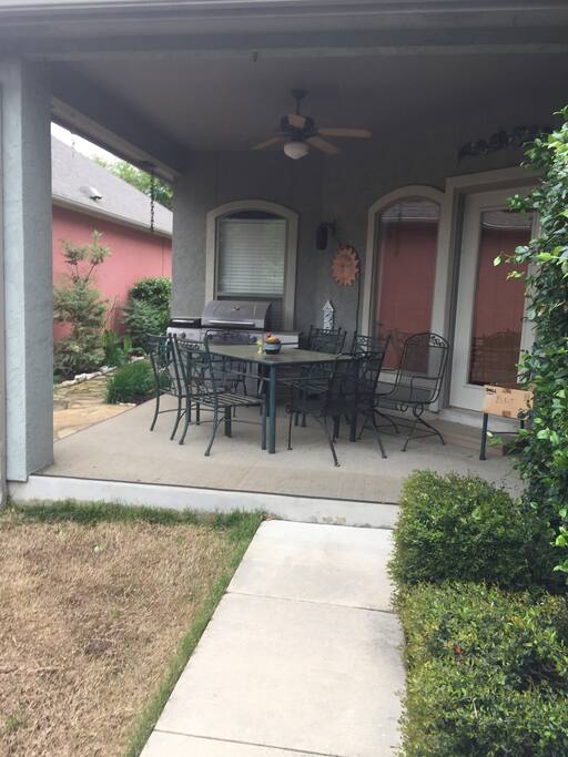 Nice back porch with a grill that has a propane tank, seats 6 on porch and has another table for 4 just off patio.