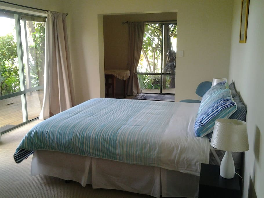 Large suite with private entrance. Suite has ensuite with shower, tea/coffee making, microwave, fridge, washing machine/dryer available to use. Sliding doors open to private deck where you can relax and enjoy the garden complete with birdsong.