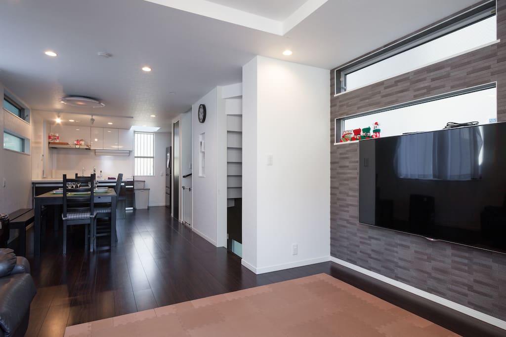 Dining, living room and kitchen. 65" 4K Smart TV.