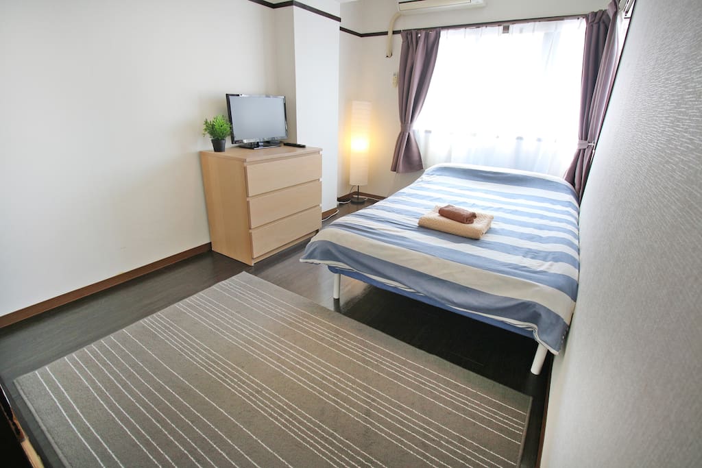 Bedroom 1 with double bed and TV