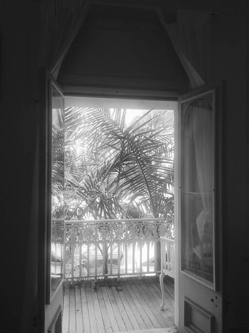 Doors out to the private verandah from the huge private bedroom (with fully functioning heritage fireplace). This is a beautiful room.