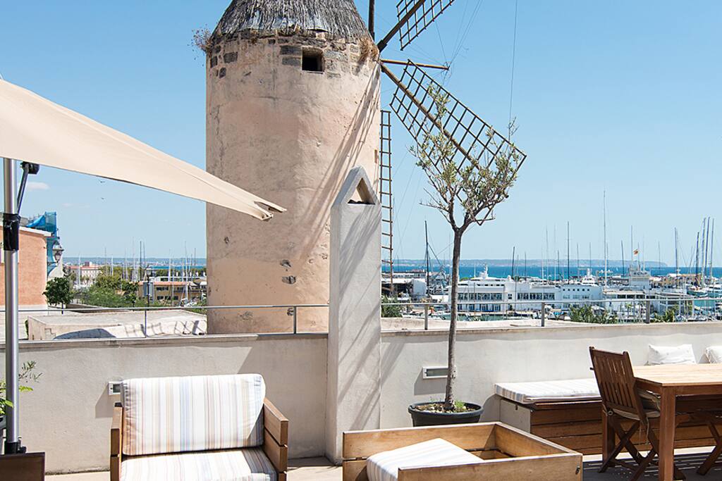 View to east to Club Nautico and the harbor. Also the significative for Mallorca is the windmill where an old closed museum is next door for spectacular view and feeling.
