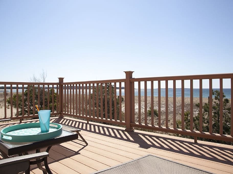 View from deck to the Ocean with lounge chairs