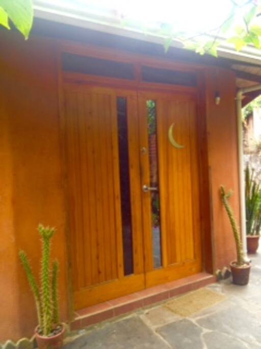 Front doors of unique, octogonal, moon house.