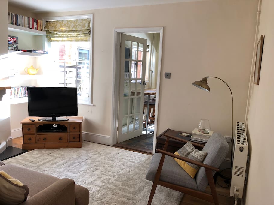 Sitting room with 3-seater sofa, armchair, wood burning stove, wifi, www.NowTV.com, DVD player and DVD's