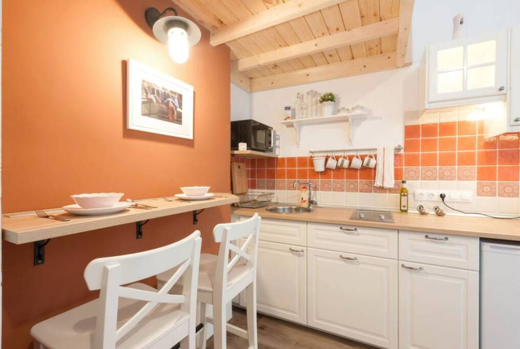 The dining area with the lovely kitchen behind.