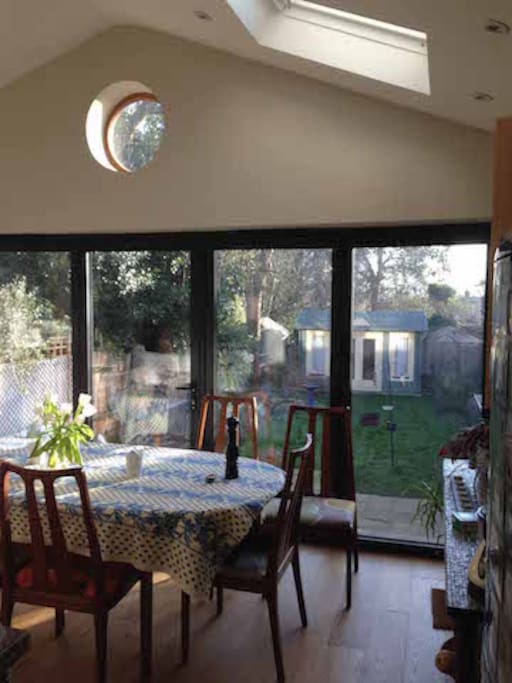Eating area overlooking terrace and garden