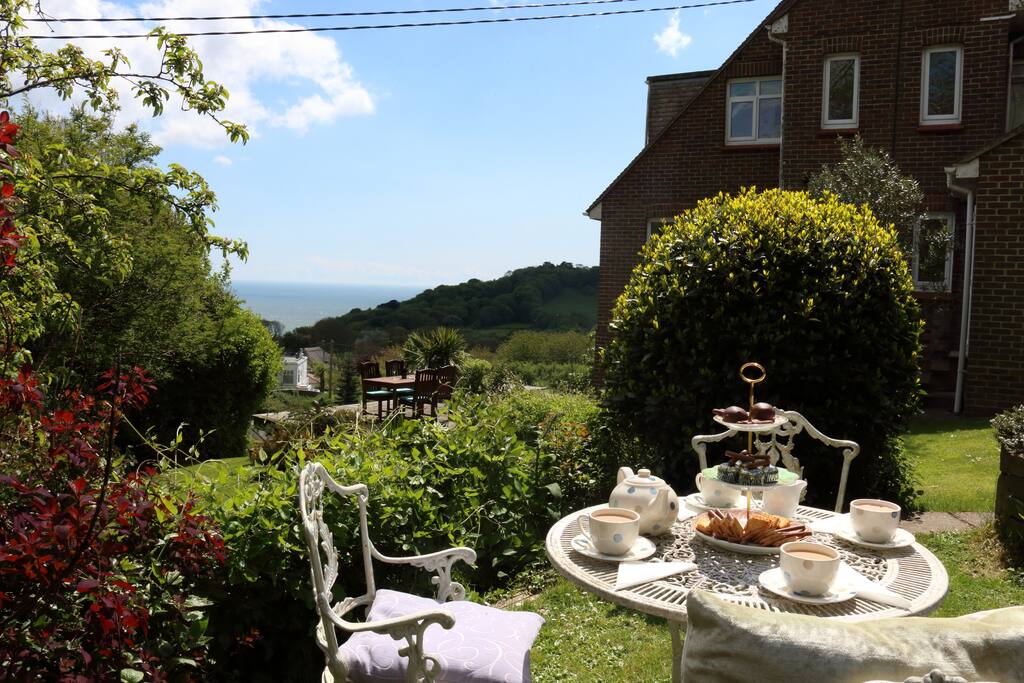 You could take your afternoon tea in the garden, gazing out over the sea and downs.
