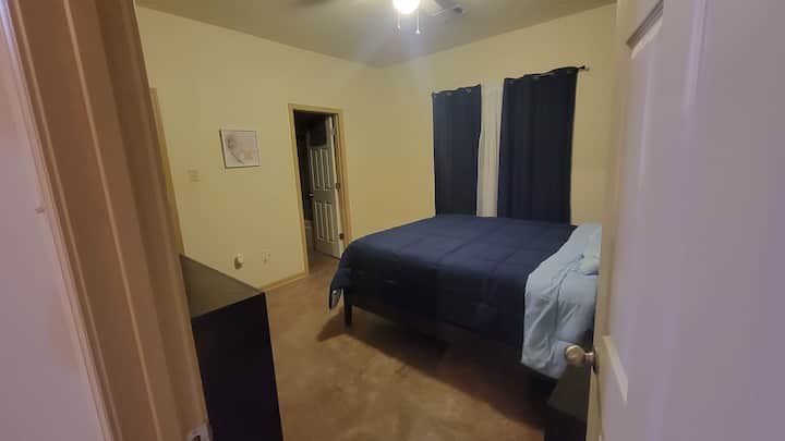 Master bedroom with its on bathroom. Queen sized bed.