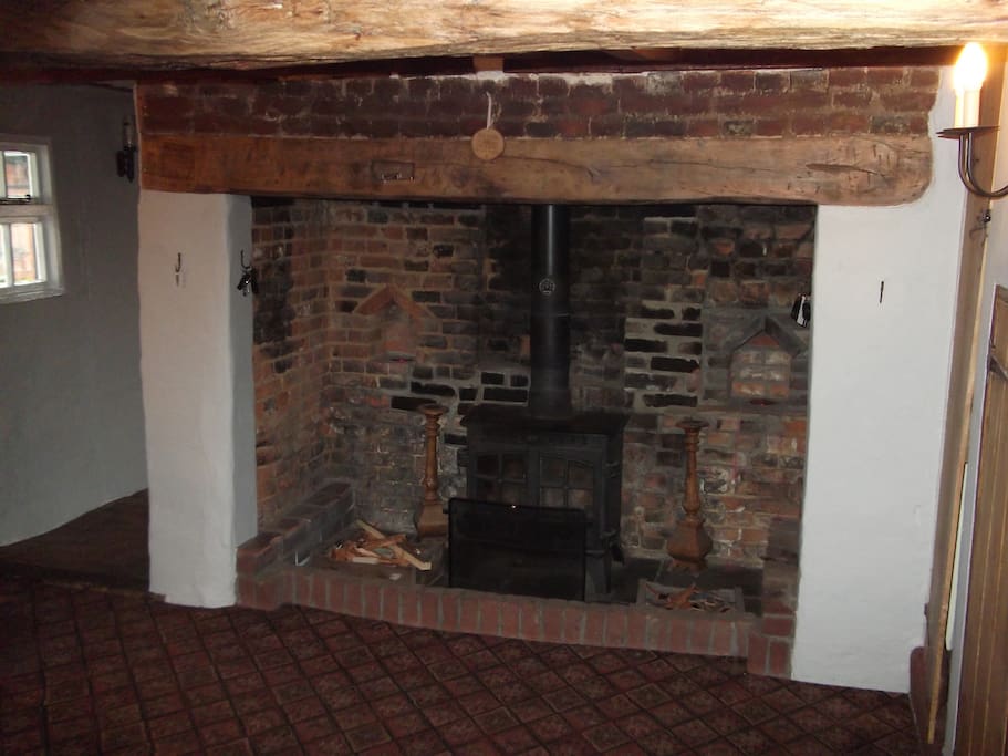 The large Inglenook fireplace takes centre stage in the entrance hall
