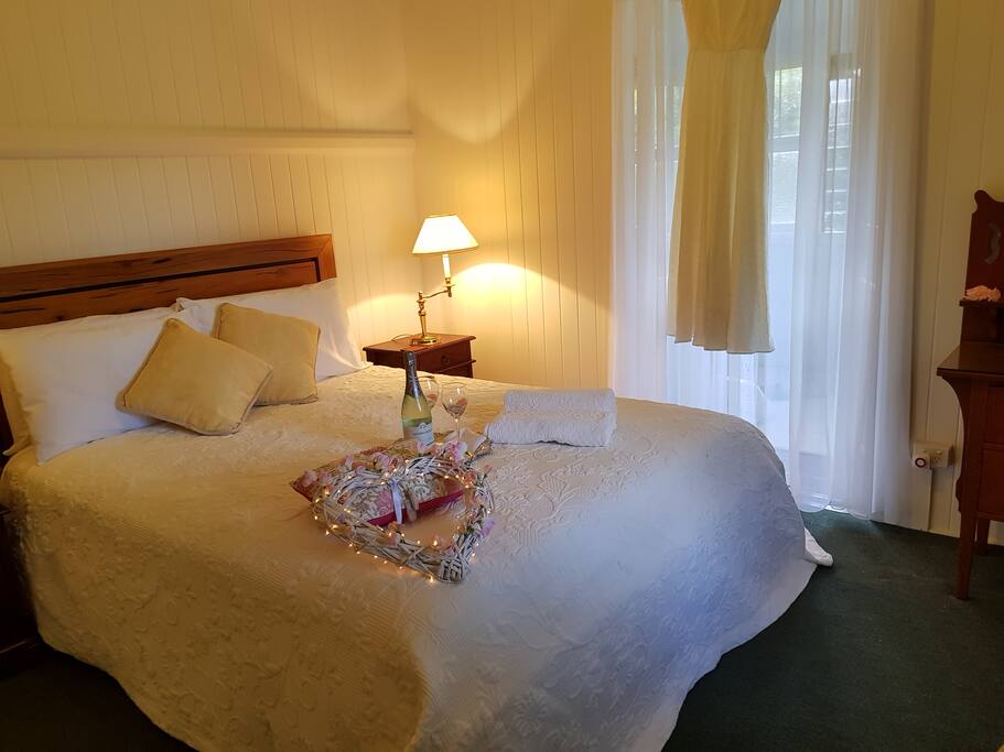 Main bedroom with a queen bed. Romance is in the air.