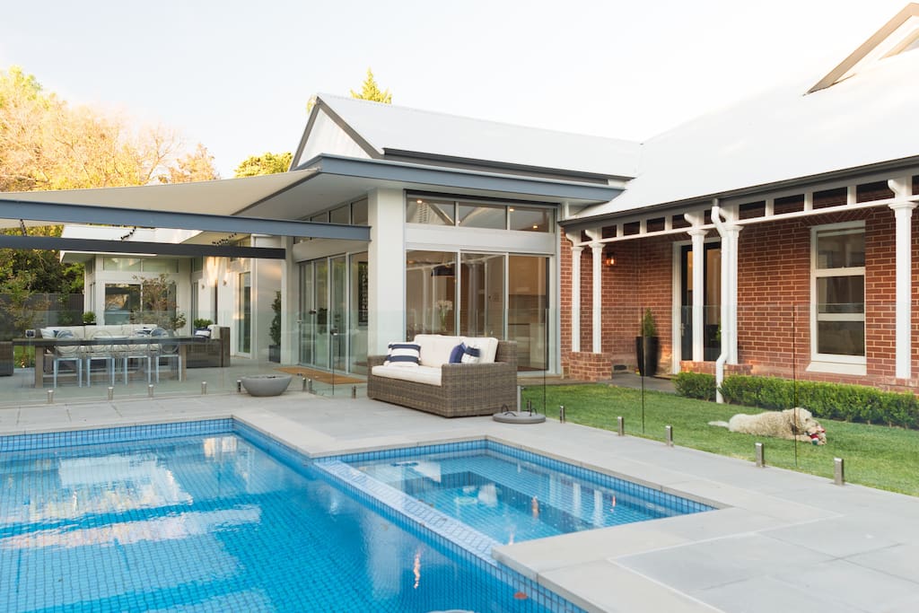 Outdoor dining area with pool & spa